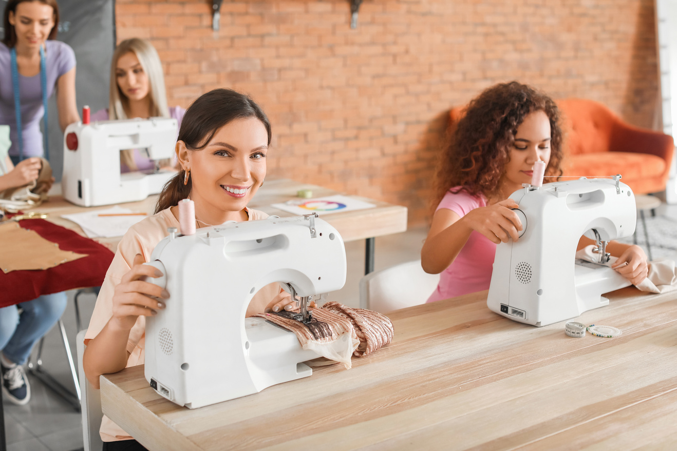 Group of Women Sewing in a Tailor Class